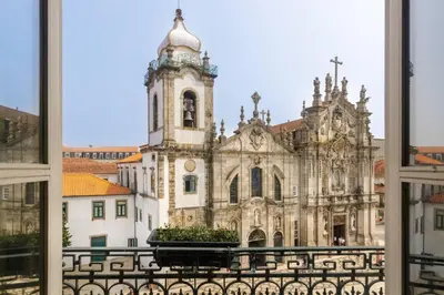 an old building with a tower and a church at Hungarian Biscuits Historic Center in Porto