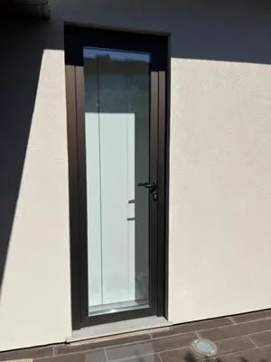 a door on a white wall with a window at JM Alojamento local no Porto in Porto