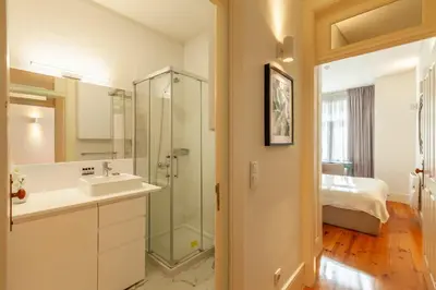 a bathroom with a sink and a shower at D&S - Alvares Cabral in Porto