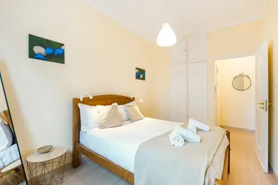 a bedroom with a bed and two towels on it at GuestReady - A pleasant stay in Porto in Porto