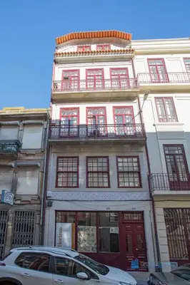 a white car parked in front of a building at Porto Almada Design Loft in Porto