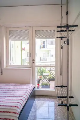 a bedroom with a bed and a window at OPO Domus in Porto