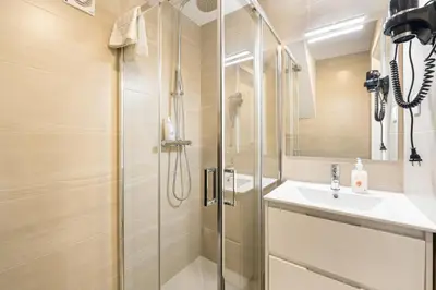 a bathroom with a shower and a sink at GuestReady - King House 2 in Porto