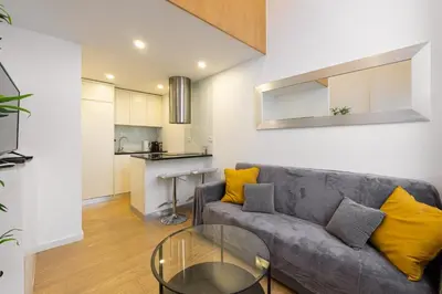 a living room with a couch and a glass table at GuestReady - King House 2 in Porto