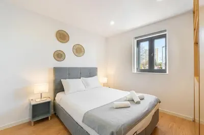 a bedroom with a large white bed with a window at GuestReady - King House 2 in Porto