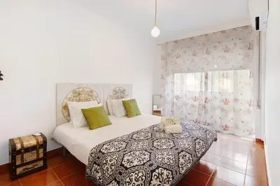 a bedroom with a bed and a window at Trindade Porto City Centre in Porto