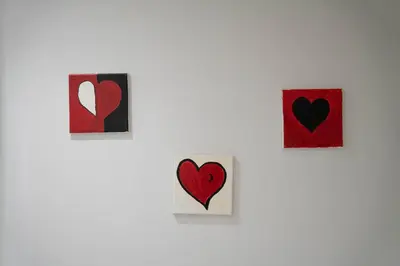 a group of hearts hanging on a wall at Primrose 1BR Delight w Parking by LovelyStay in Porto