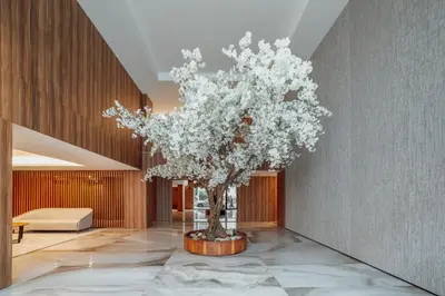 a tree in the middle of a lobby at OPORTO GUEST Renovato Luxus Flat w/ parking in Porto