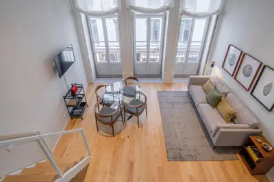 a living room with a couch and a table at Almada 151 Porto in Porto