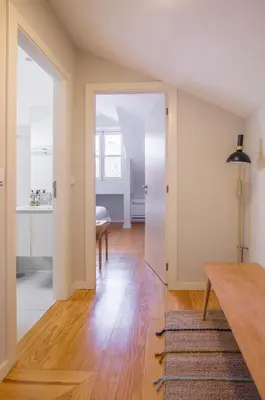 a living room with a table and a dining room at Almada 151 Porto in Porto