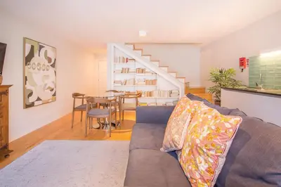 a living room with a couch and a table at Almada 151 Porto in Porto