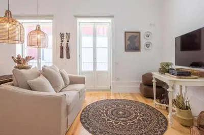 a living room with a couch and a table at 157 Flores Apartment in Porto