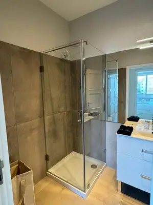 a bathroom with a shower with a glass door at The Cale - Porto, Sá da Bandeira in Porto
