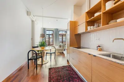 a kitchen with a table and a sink at Hey Apartments C in Porto