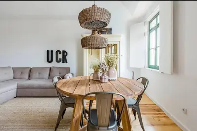 a living room with a table and a couch at 1892 - Ribeira Loft in Porto