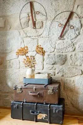 two suitcases stacked on top of each other in front of a wall at 1892 - Ribeira Loft in Porto
