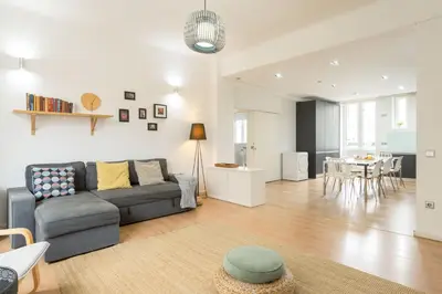 two beds in a room with a window at Feel Porto Downtown Apartments & Studios in Porto