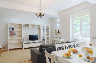 a bedroom with two beds and a window at Feel Porto Downtown Apartments & Studios in Porto