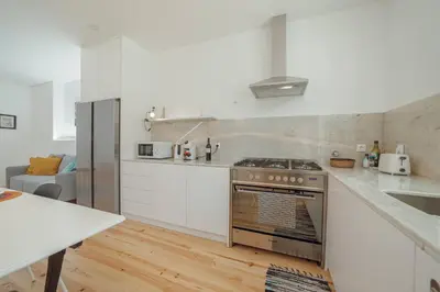a kitchen with a stove and a counter top at Modern Villa by Hosty in Porto