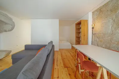 a living room with a couch and a table at Cozy Almada by Hosty in Porto