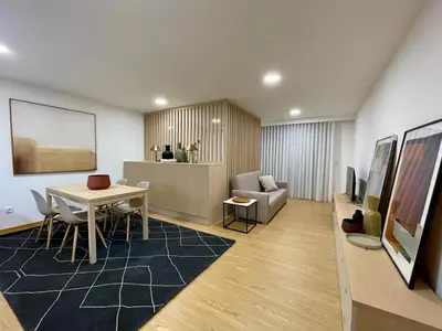 a living room with a table and a couch at Oporto Chic & Cozy - Anibal Cunha in Porto
