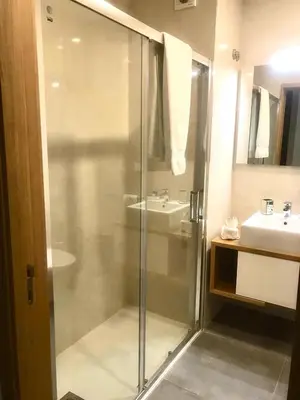a bathroom with a glass shower and a sink at Oporto Chic & Cozy - Anibal Cunha in Porto