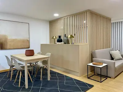 a living room with a table and chairs and a couch at Oporto Chic & Cozy - Anibal Cunha in Porto