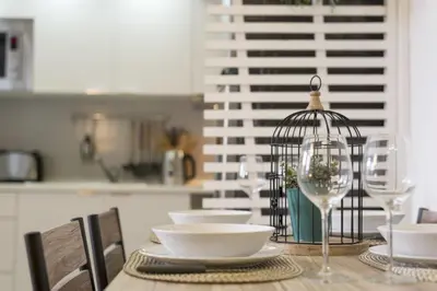 a dining room table with a bird cage on it at Santo Ildefonso RicaHouses in Porto