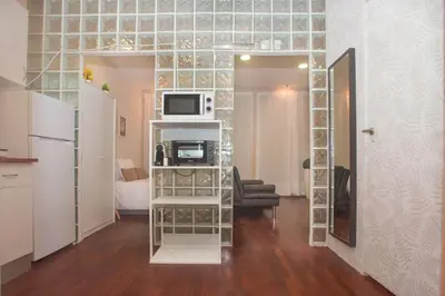 a small room with a kitchen and a microwave at Bonsai Apartment 5 in Porto