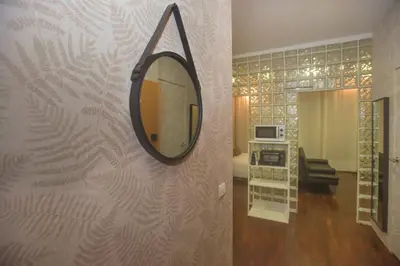 a mirror hanging on a wall in a room at Bonsai Apartment 5 in Porto