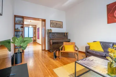 a living room with a couch and a piano at Sublime Downtown Retreat by ELSA, 180m2 in Porto