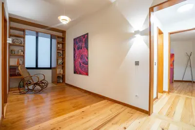 a living room with a large painting on the wall at Sublime Downtown Retreat by ELSA, 180m2 in Porto