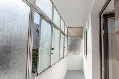 a hallway with large windows in a building at Morro Garden Apartment by Hosty in Vila Nova de Gaia