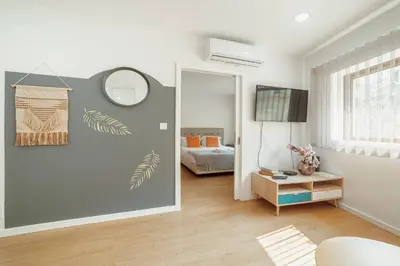 a living room with a mirror and a bedroom at Coliseu Apartment by Hosty in Porto