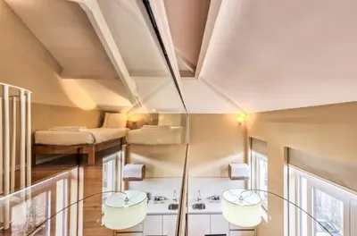 a room with two chairs and two beds at PATH Bonjardim Apartments in Porto