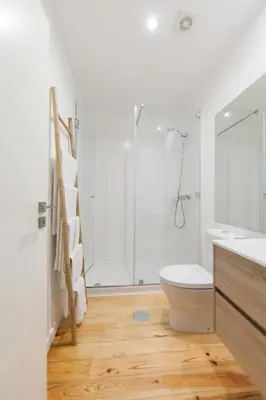 a bathroom with a shower and a toilet and a sink at Citybreak-apartments Sao Bento in Porto
