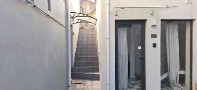 a stairway leading up to a building with a staircase at Villa Terra The Garden in Vila Nova de Gaia