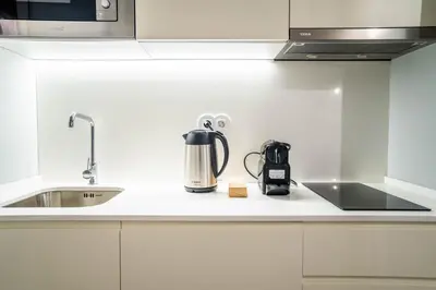 a kitchen counter with a coffeemaker and a coffee maker at Sta Catarina 632 by LovelyStay in Porto