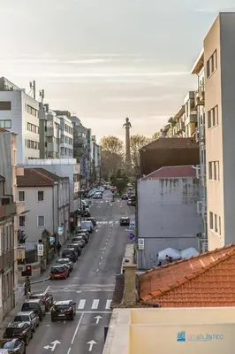 a city street with a view of the eiffel tower at Boavista Charm Balcony Loft in Porto