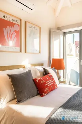 a bedroom with a bed with pillows on it at Boavista Charm Balcony Loft in Porto