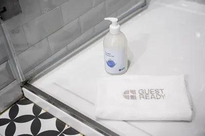 a bottle of detergent sitting on a counter in a bathroom at GuestReady - Lovely heaven in Porto in Porto