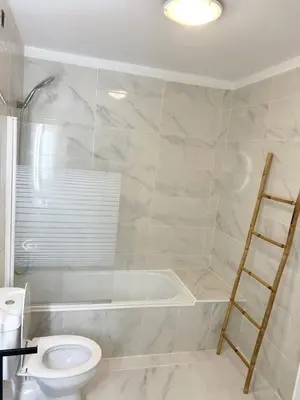 a bathroom with a toilet and a bath tub at Oporto Music Flat - Very Central & Free Parking in Porto