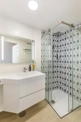a bathroom with a sink and a shower at Clérigos Apartments Porto - Premium in Porto