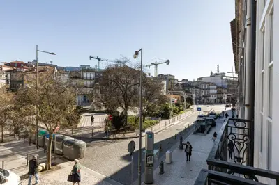 a group of people walking down a city street at Clérigos Apartments Porto - Premium in Porto