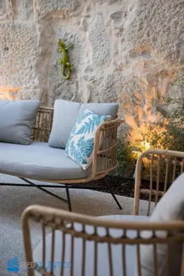 a table and two chairs on a patio at Quinta da Boa Vista Garden & Terrace in Porto