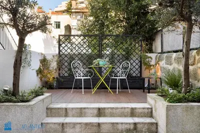 a bedroom with a bed and a green wall at Quinta da Boa Vista Garden & Terrace in Porto