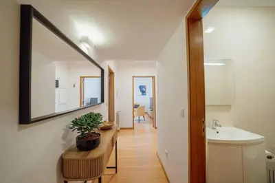 a bathroom with a sink and a mirror on the wall at Boavista Premium by Hosty in Porto