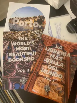 a pile of posters on a table at River Place in Porto