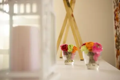 two vases with flowers in them sitting on a table at Clerigos Studio Apts in Porto