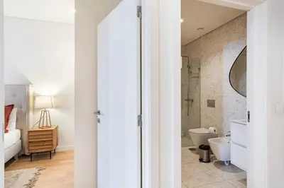 a bathroom with a toilet and a sink at GuestReady - A secret passage in Porto in Porto